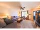 Cozy living room with ceiling fan, plush seating, and natural light at 15460 Follow Dr, Noblesville, IN 46060