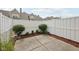 Fenced-in back yard featuring a small patio area and minimal landscaping for easy maintenance at 15553 Portland Dr, Westfield, IN 46074