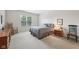 Comfortable bedroom with a bed, a window, and a nightstand with a lamp at 15553 Portland Dr, Westfield, IN 46074