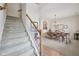 Elegant dining area with staircase, perfect for Gathering meals and entertaining guests at 15553 Portland Dr, Westfield, IN 46074
