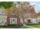 Beautiful brick townhouse with lush landscaping and mature trees at 15553 Portland Dr, Westfield, IN 46074