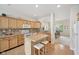 Spacious kitchen with an island, wood cabinets, and an adjacent dining area at 15553 Portland Dr, Westfield, IN 46074