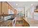 Bright kitchen with wood cabinets, mosaic backsplash, and ample counter space at 15553 Portland Dr, Westfield, IN 46074