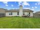 Spacious backyard with a patio and seating area, ideal for outdoor entertaining at 1896 Central Park W Blvd, Greenwood, IN 46143