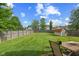 Expansive backyard featuring a well-maintained lawn, wooden fence, and a storage shed at 1896 Central Park W Blvd, Greenwood, IN 46143