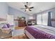 Bright bedroom featuring hardwood floors, a vaulted ceiling, and large windows for natural light at 1896 Central Park W Blvd, Greenwood, IN 46143