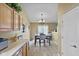 Eat-in kitchen features a dining area with a chandelier and patriotic-themed decor at 1896 Central Park W Blvd, Greenwood, IN 46143