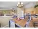 Cozy eat-in kitchen and dining area with a view of the kitchen appliances and the living room at 1896 Central Park W Blvd, Greenwood, IN 46143