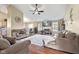Comfortable living room with a fireplace, ceiling fan, and access to the dining area at 1896 Central Park W Blvd, Greenwood, IN 46143