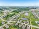 Scenic aerial shot of a residential neighborhood with ponds, green spaces, and tree-lined streets in a planned community at 19281 Scofield Ridge Blvd, Westfield, IN 46074