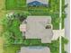 Aerial image of a home with a landscaped backyard featuring a covered patio and a serene pond in the community at 19281 Scofield Ridge Blvd, Westfield, IN 46074