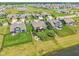 An aerial shot of a suburban community with ponds, lush greenery, and well-kept lawns in a picturesque setting at 19281 Scofield Ridge Blvd, Westfield, IN 46074