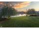 Beautiful backyard with pond view, mature willow trees and well maintained grass at 19281 Scofield Ridge Blvd, Westfield, IN 46074