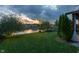 Lush backyard with a pond and mature trees, offering a serene and private outdoor space at 19281 Scofield Ridge Blvd, Westfield, IN 46074