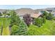 Well-manicured lawn and landscaping create a park-like backyard setting with mature trees and private outdoor space at 19281 Scofield Ridge Blvd, Westfield, IN 46074