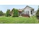 Landscaped backyard with lawn, patio, and mature trees at 19281 Scofield Ridge Blvd, Westfield, IN 46074