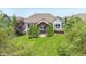 Charming backyard features a covered patio with a hot tub and well-maintained landscaping at 19281 Scofield Ridge Blvd, Westfield, IN 46074