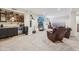 Basement wet bar with wine rack, microwave, beverage fridge, and granite countertop at 19281 Scofield Ridge Blvd, Westfield, IN 46074