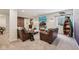 Finished basement featuring cozy leather seating, entertainment center, and rustic barn doors at 19281 Scofield Ridge Blvd, Westfield, IN 46074