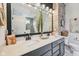 Modern bathroom features double sinks, stylish lighting and a decorative brick accent wall at 19281 Scofield Ridge Blvd, Westfield, IN 46074