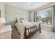 Comfortable bedroom with large window letting in natural light, complemented by a plush carpet and soft, neutral color scheme at 19281 Scofield Ridge Blvd, Westfield, IN 46074