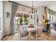 Cozy dining area with sliding glass door to the covered patio overlooking the lake at 19281 Scofield Ridge Blvd, Westfield, IN 46074