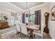 This dining room features a wooden table and chairs with stylish curtains and a decorative light fixture at 19281 Scofield Ridge Blvd, Westfield, IN 46074