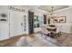 Elegant dining room featuring stylish decor, modern lighting, and a view to the entrance at 19281 Scofield Ridge Blvd, Westfield, IN 46074
