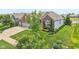Charming brick home features a well-manicured lawn, mature trees, and an attached two-car garage at 19281 Scofield Ridge Blvd, Westfield, IN 46074