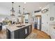 Spacious kitchen with island, stainless steel appliances, and modern pendant lighting at 19281 Scofield Ridge Blvd, Westfield, IN 46074
