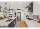 Open concept kitchen with island, stainless steel appliances, and sleek countertops at 19281 Scofield Ridge Blvd, Westfield, IN 46074