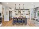 Modern kitchen with a large island, bar seating, and stylish pendant lighting at 19281 Scofield Ridge Blvd, Westfield, IN 46074