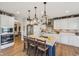 Modern kitchen with a large island, bar seating, and stylish pendant lighting at 19281 Scofield Ridge Blvd, Westfield, IN 46074