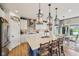 Modern kitchen with a large island, bar seating, and stylish pendant lighting at 19281 Scofield Ridge Blvd, Westfield, IN 46074
