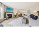 Stylish living room with modern decor, fireplace, and comfortable seating at 19281 Scofield Ridge Blvd, Westfield, IN 46074