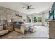 A spacious bedroom with an accent brick wall, large windows and a ceiling fan at 19281 Scofield Ridge Blvd, Westfield, IN 46074