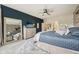 Spacious bedroom with gray brick wall, dark blue accents, large mirror, and ample natural light at 19281 Scofield Ridge Blvd, Westfield, IN 46074