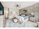 A spacious bedroom with an accent brick wall, large windows and a ceiling fan at 19281 Scofield Ridge Blvd, Westfield, IN 46074
