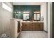 Luxurious bathroom with double vanity, a tiled accent wall, and a glass-enclosed shower at 20005 Gansett Rd, Westfield, IN 46074