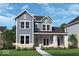 Charming two-story home with blue siding, white trim, and a well-manicured lawn at 20005 Gansett Rd, Westfield, IN 46074