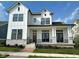 Modern two-story home with white siding, black trim, and stone accents on the porch columns at 20005 Gansett Rd, Westfield, IN 46074