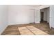 A spacious bedroom features stylish flooring and a doorway to an adjoining room at 202 Asbury Dr, Anderson, IN 46013