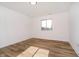 Bright bedroom with light colored floors and a large window providing lots of natural light at 202 Asbury Dr, Anderson, IN 46013
