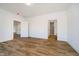 Spacious bedroom featuring hardwood floors and doors leading to the kitchen and bathroom at 202 Asbury Dr, Anderson, IN 46013