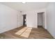 Large bedroom with open closet and doorways on either side of the room at 202 Asbury Dr, Anderson, IN 46013
