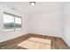 Bright bedroom with large window and light-colored floors providing ample natural light at 202 Asbury Dr, Anderson, IN 46013