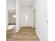 Inviting entryway with a white front door and beautiful hard surface flooring at 202 Asbury Dr, Anderson, IN 46013