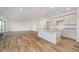 Modern kitchen and living room area featuring an open floor plan and hardwood floors at 202 Asbury Dr, Anderson, IN 46013