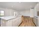 Modern kitchen featuring a kitchen island with a sink and granite countertops at 202 Asbury Dr, Anderson, IN 46013