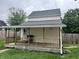 Cozy back porch with wooden railings, perfect for relaxing and enjoying the outdoors at 2244 Lafayette St, Anderson, IN 46012